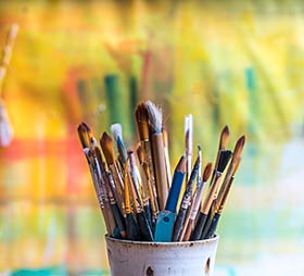 Paint brushes in a cup