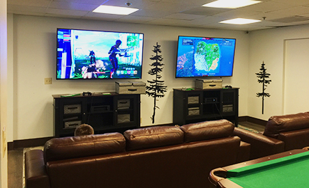Children playing video games in the Tenaya Lodge Game Room