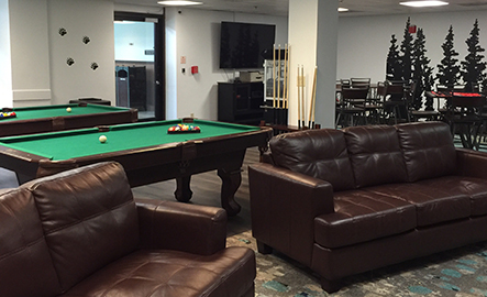 Game room at Tenaya Lodge with pool tables, video games and board games.
