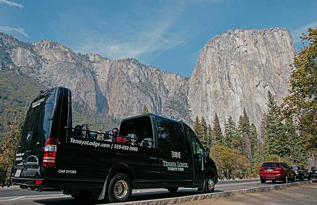 Tenaya Lodge Tours' exclusive open-top bus below El Capitan in Yosemite Valley