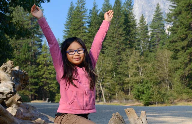 Young girl along the Merced River in Yosemite Valley