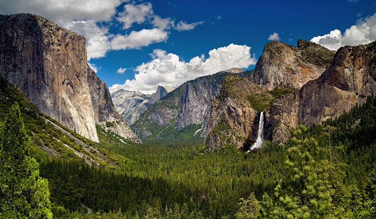 View of El Capitan, Half Dome, the Cathedrals and Bridalveil Fall in Yosemite Valley from Tunnel View